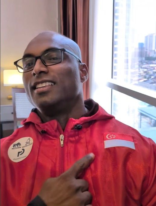 Danie Dharma wearing a Team Singapore sweater in an IG video.jpg